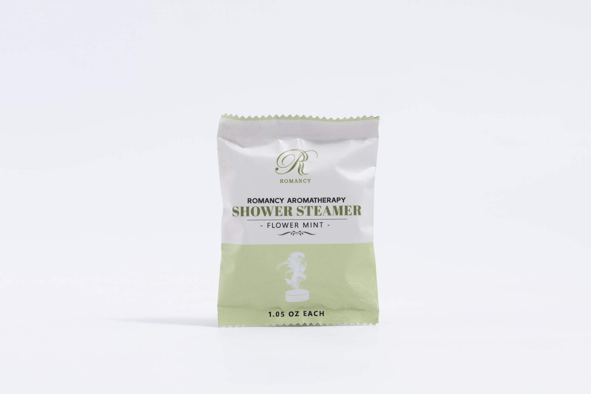 Romancy aromatherapy shower steamer packet in Flower Mint scent on a white background
